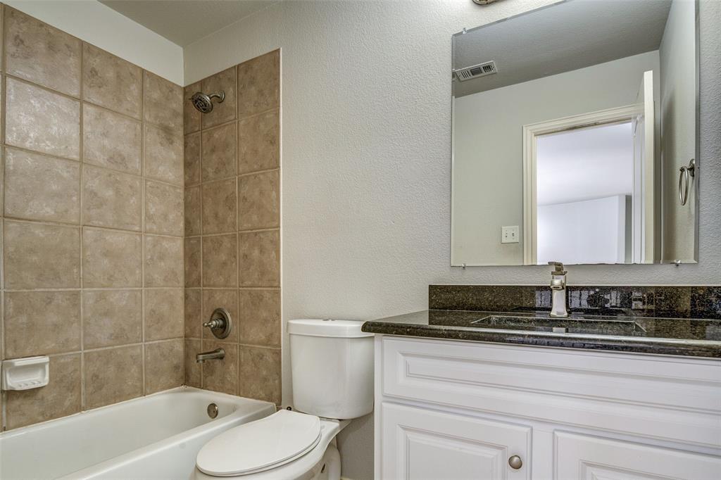 916 Carlsbad Drive Allen, TX 75002 - Photo 30 of 34 a bathroom with a bathtub shower sink and toilet