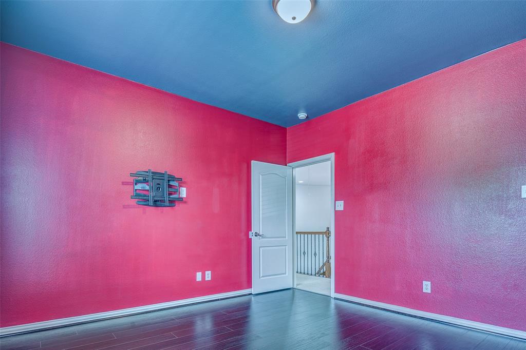 916 Carlsbad Drive Allen, TX 75002 - Photo 32 of 34 a view of empty room with wooden floor