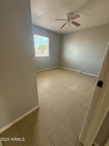 a view of an empty room and a window