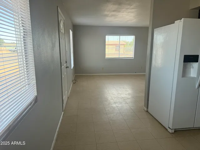 a kitchen with stainless steel appliances a refrigerator sink and microwave