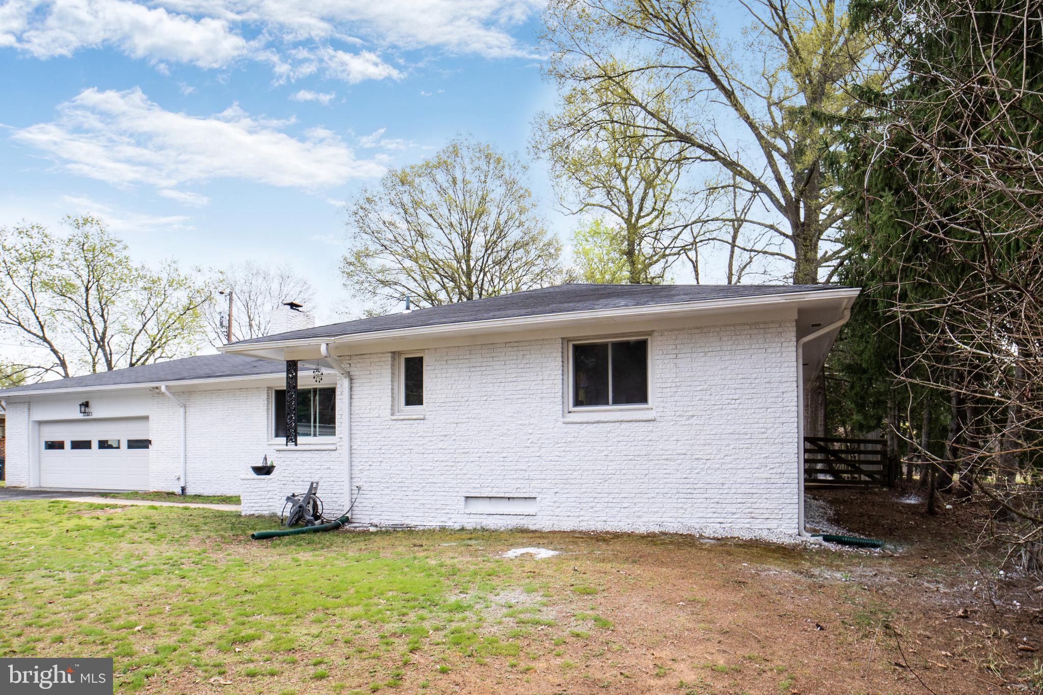 12323 Lanham Severn Road Bowie, MD 20720 - Photo 1 of 20 a view of a backyard with a garden and plants