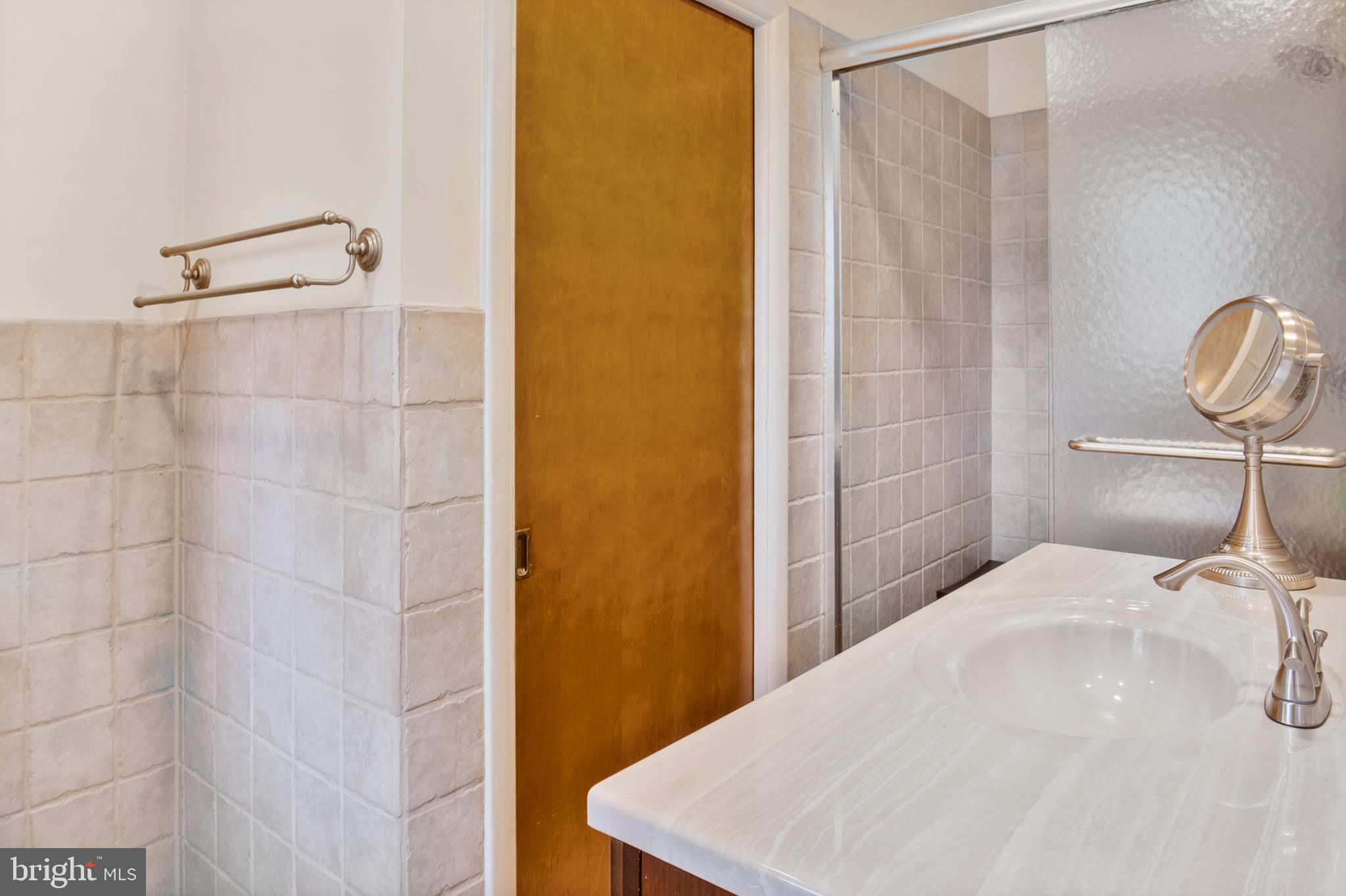 12323 Lanham Severn Road Bowie, MD 20720 - Photo 14 of 20 a bedroom with a bed and a shower