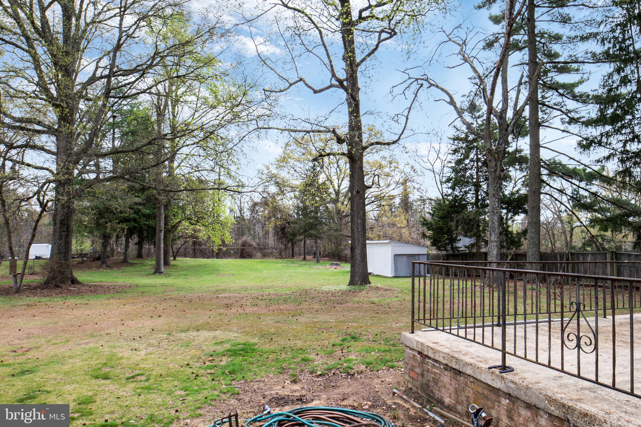 12323 Lanham Severn Road Bowie, MD 20720 - Photo 2 of 20 a view of a backyard with trees