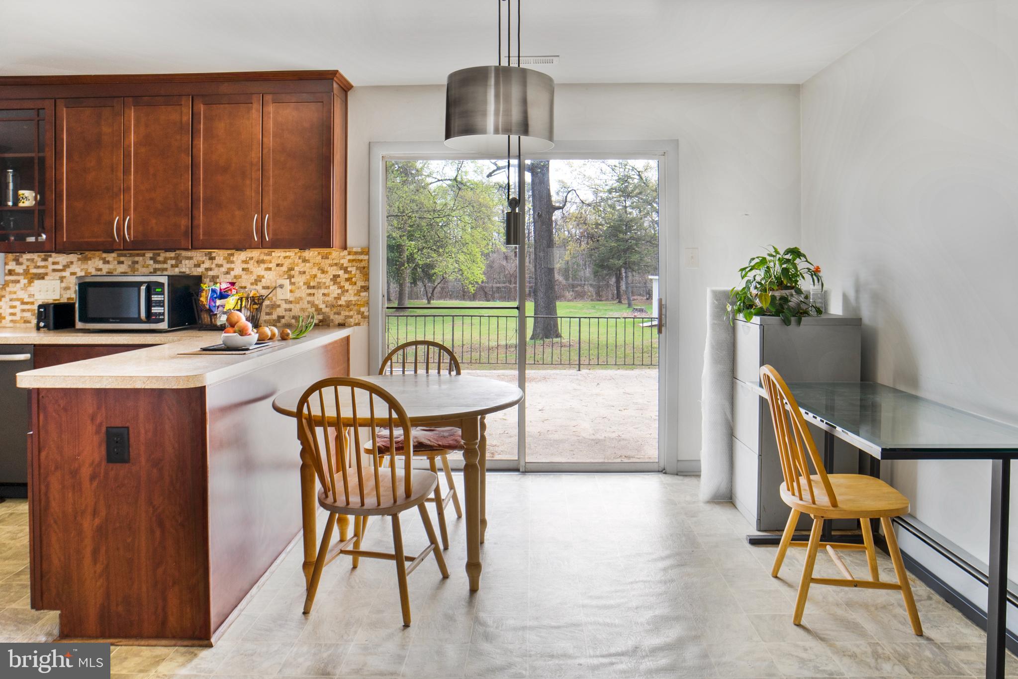 12323 Lanham Severn Road Bowie, MD 20720 - Photo 7 of 20 a dining room with furniture and window