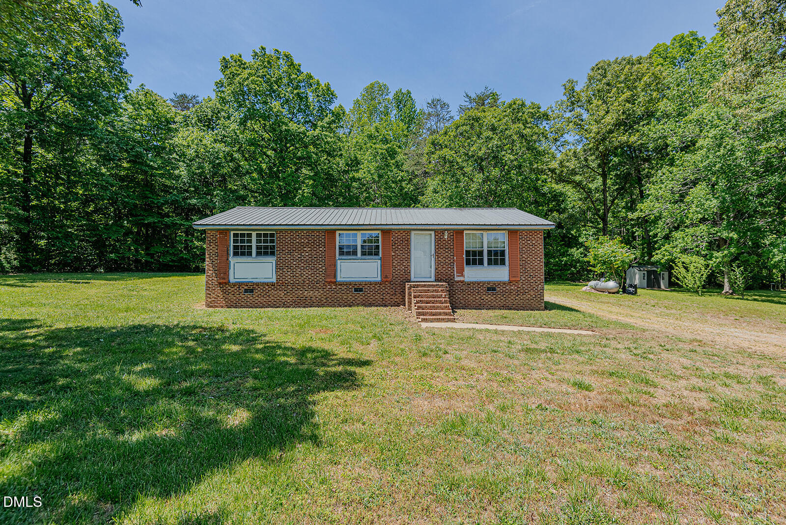 1302 Blacksmith Road Efland, NC 27243 - Photo 28 of 46 a house view with a garden space