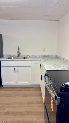 a kitchen with a sink and cabinets