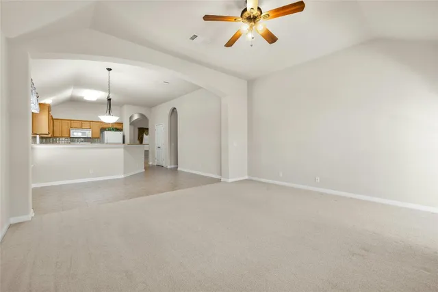 a view of a room with window and wooden floor
