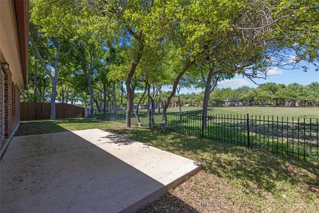 a view of a yard with a street