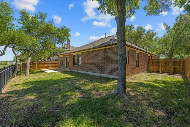 a backyard of a house with lots of green space