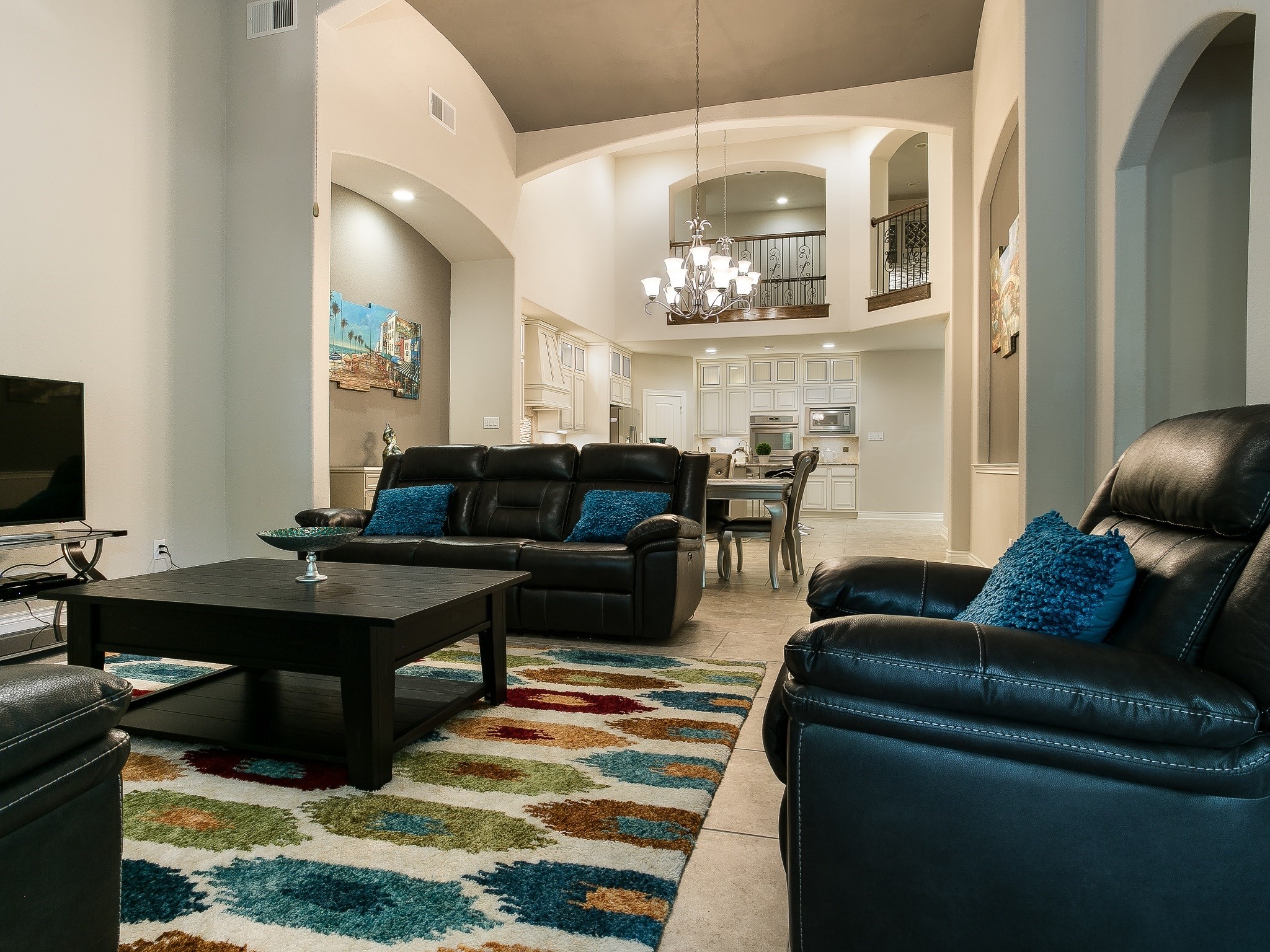 9018 Meacom Drive Conroe, TX 77384 - Photo 20 of 41 a living room with furniture and a chandelier