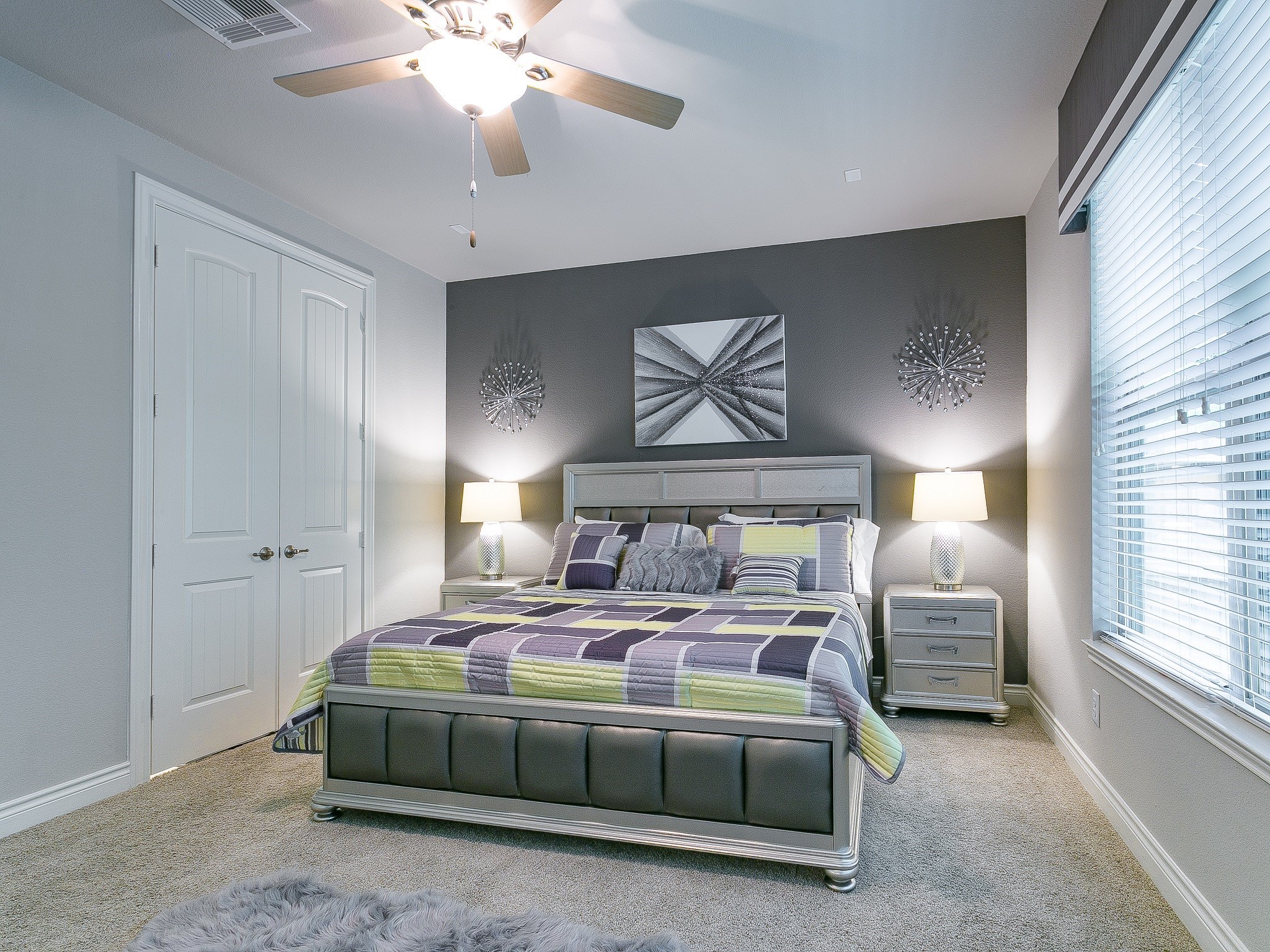 9018 Meacom Drive Conroe, TX 77384 - Photo 22 of 41 a bedroom with a bed and a chandelier