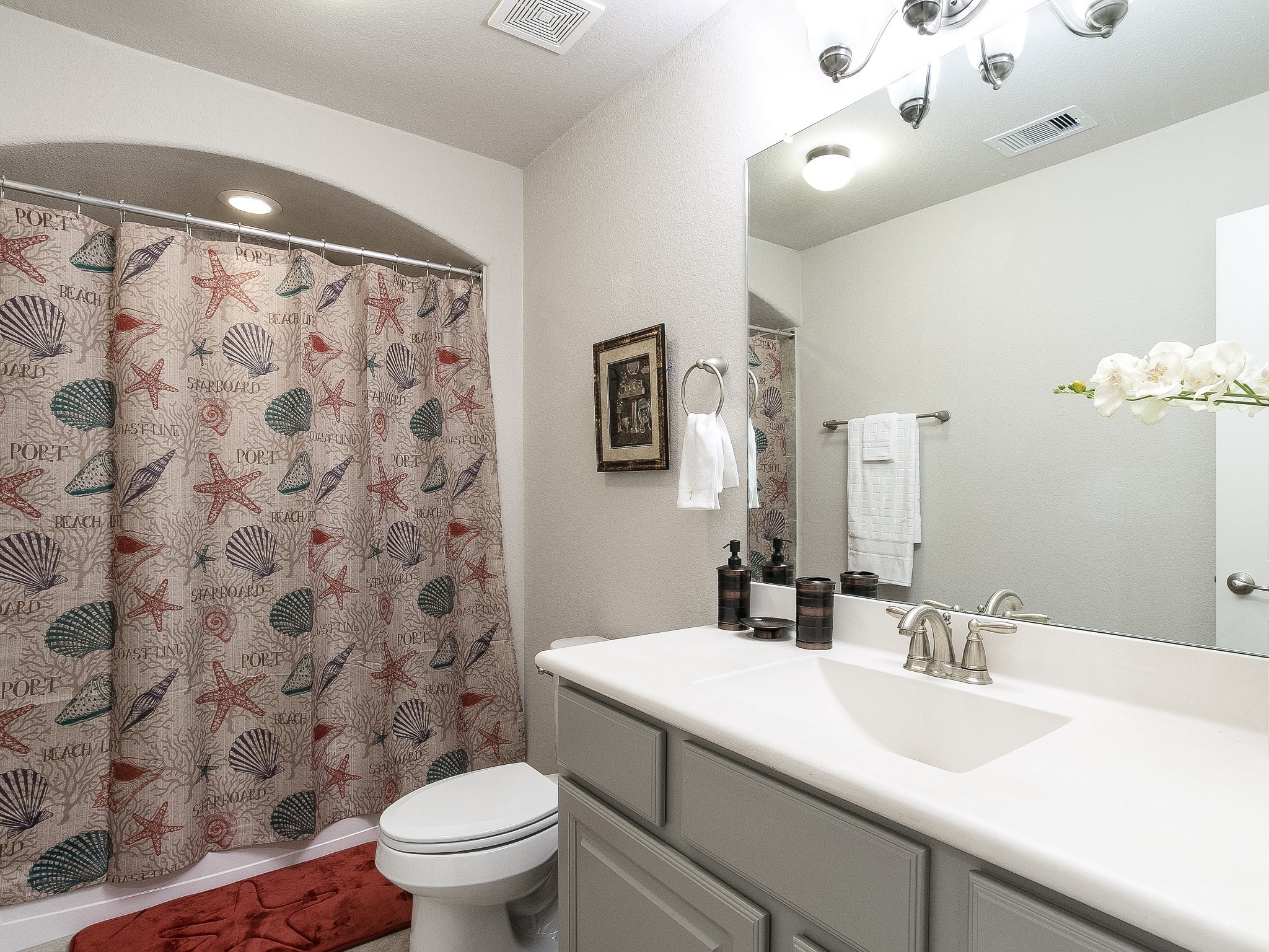 9018 Meacom Drive Conroe, TX 77384 - Photo 36 of 41 a bathroom with a sink toilet and a mirror