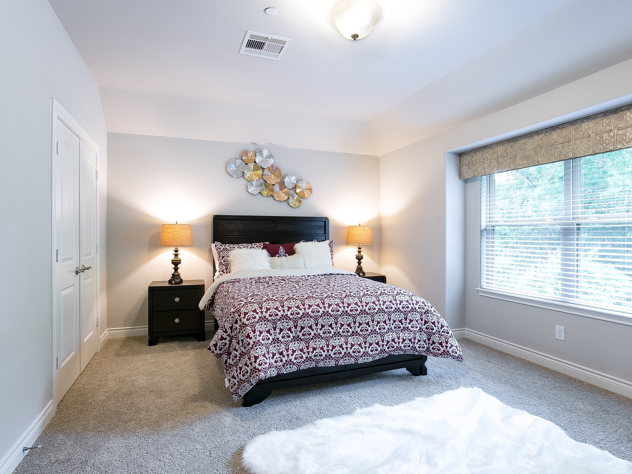 9018 Meacom Drive Conroe, TX 77384 - Photo 39 of 41 a bedroom with a bed and a window