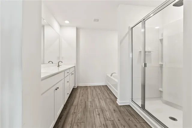 a bathroom with a double vanity sink and a mirror