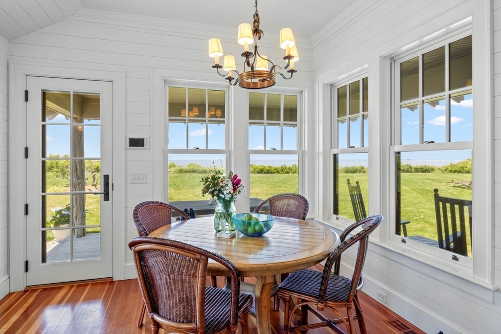 37 North Neck Road Edgartown, MA 02539 - Photo 14 of 40 a view of a dining room with furniture and a large window
