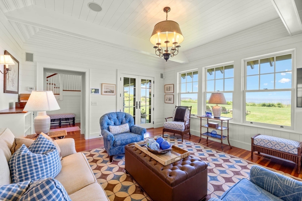 37 North Neck Road Edgartown, MA 02539 - Photo 15 of 40 a living room with furniture chandelier and a table