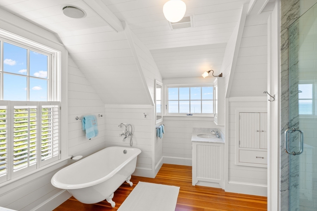37 North Neck Road Edgartown, MA 02539 - Photo 17 of 40 a bathroom with a tub toilet and window