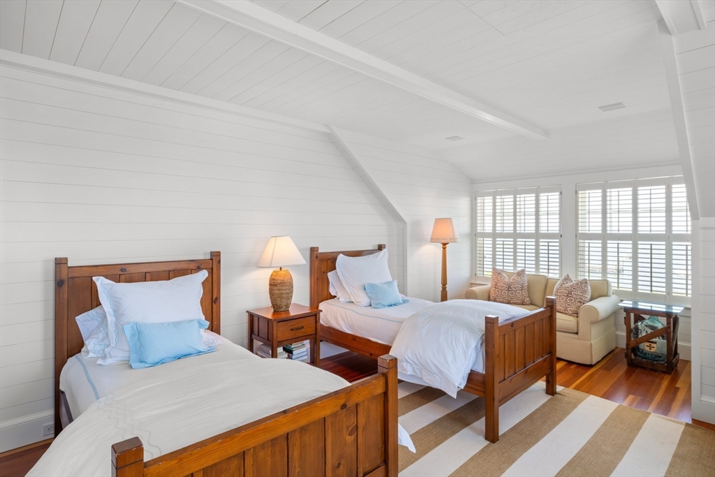 37 North Neck Road Edgartown, MA 02539 - Photo 20 of 40 a bedroom with two beds and a large window