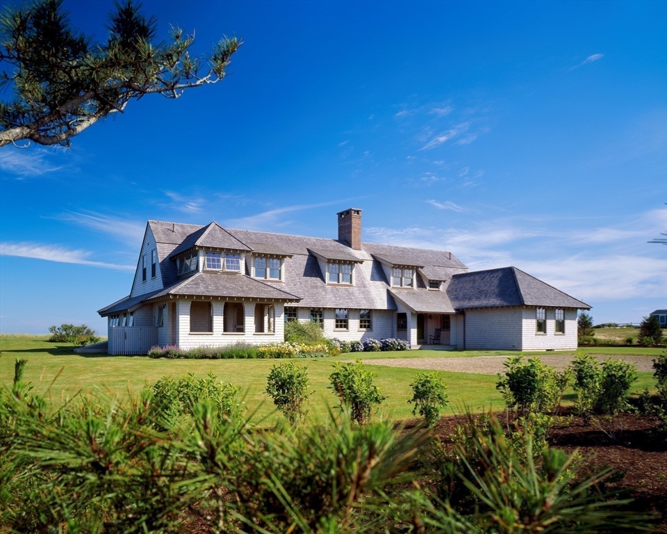 37 North Neck Road Edgartown, MA 02539 - Photo 2 of 40 a front view of a house with a garden