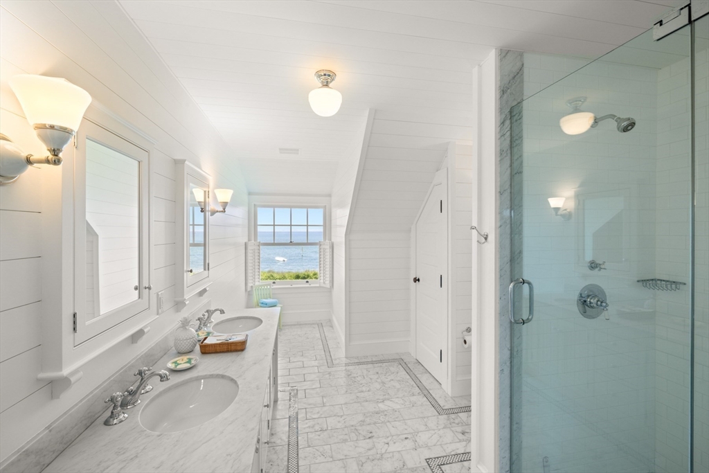 37 North Neck Road Edgartown, MA 02539 - Photo 24 of 40 a spacious bathroom with a granite countertop tub sink and mirror