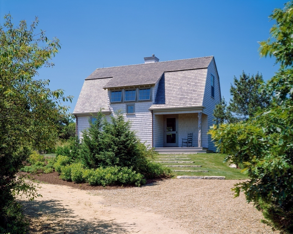 37 North Neck Road Edgartown, MA 02539 - Photo 27 of 40 a front view of a house with a garden