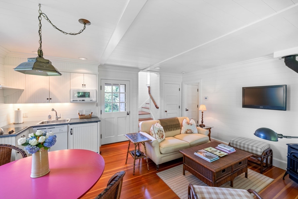 37 North Neck Road Edgartown, MA 02539 - Photo 29 of 40 a living room with furniture a rug and a chandelier