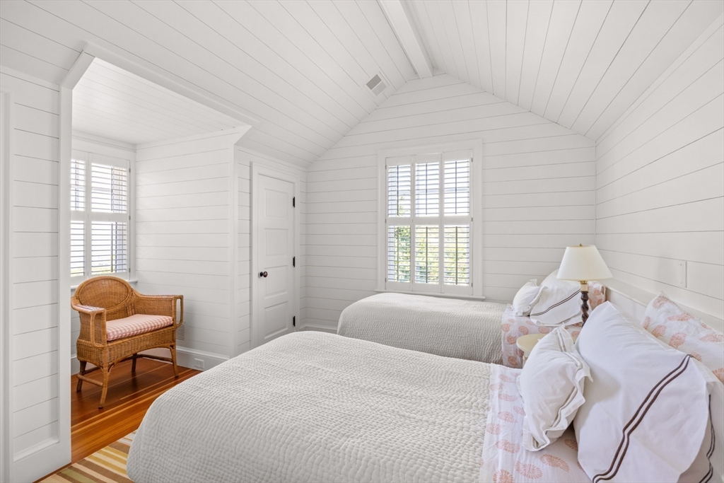 37 North Neck Road Edgartown, MA 02539 - Photo 32 of 40 a bedroom with a bed and a window