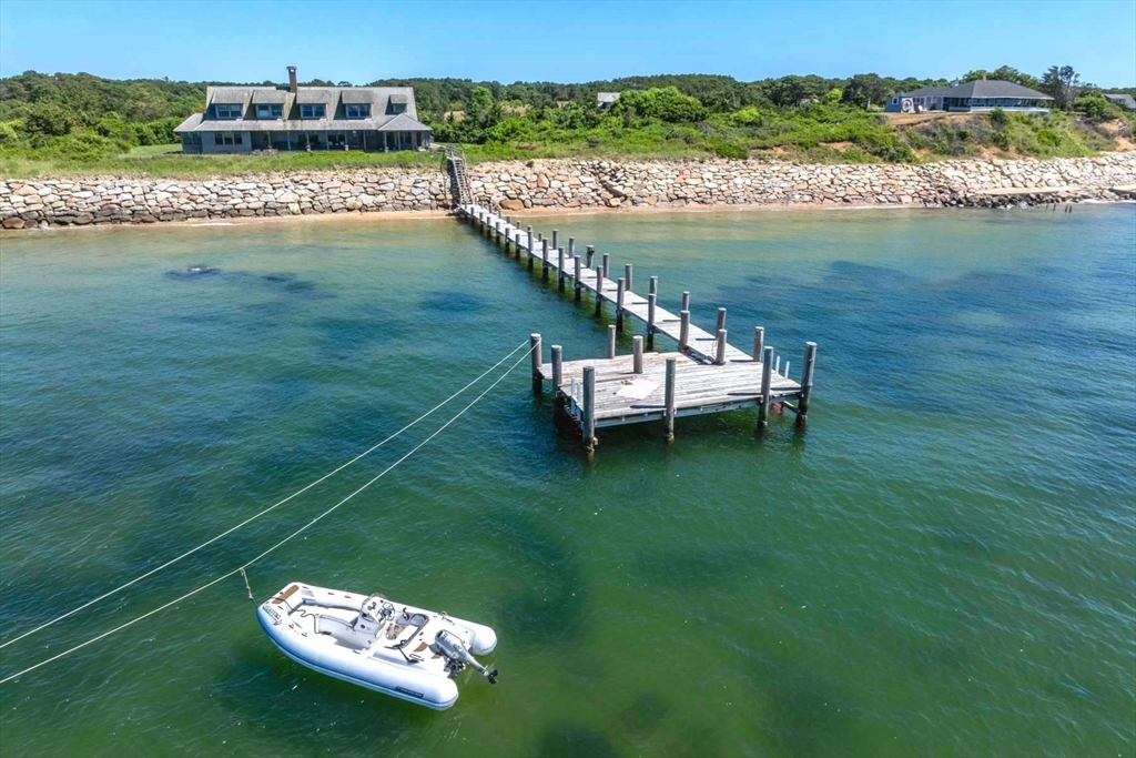 37 North Neck Road Edgartown, MA 02539 - Photo 36 of 40 a view of a lake with a mountain in the background