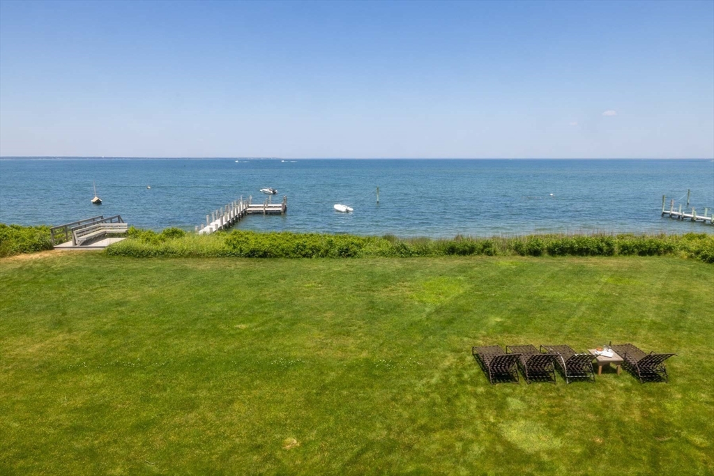 37 North Neck Road Edgartown, MA 02539 - Photo 7 of 40 a view of a lake with a big yard