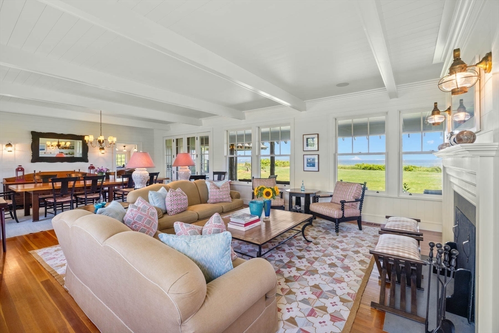 37 North Neck Road Edgartown, MA 02539 - Photo 10 of 40 a living room with fireplace furniture and a large window