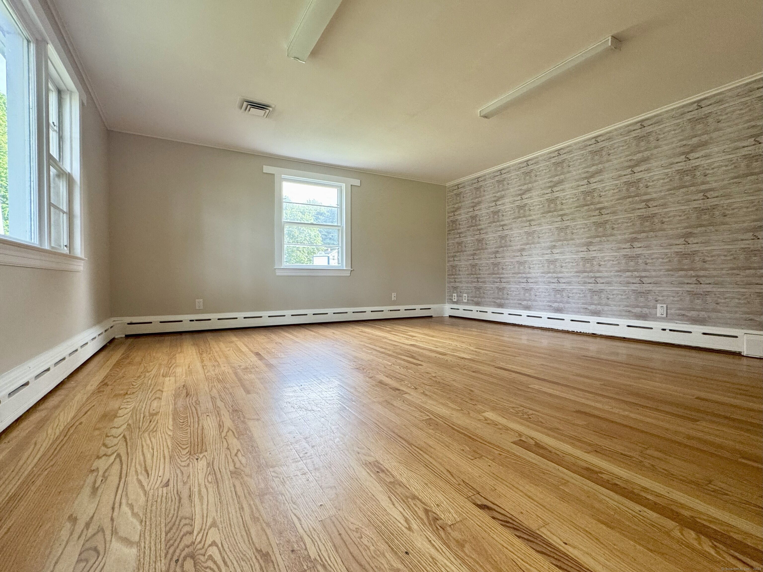 160 Wolcott Street Bristol, CT 06010 - Photo 9 of 36 a view of a room with wooden floor and window