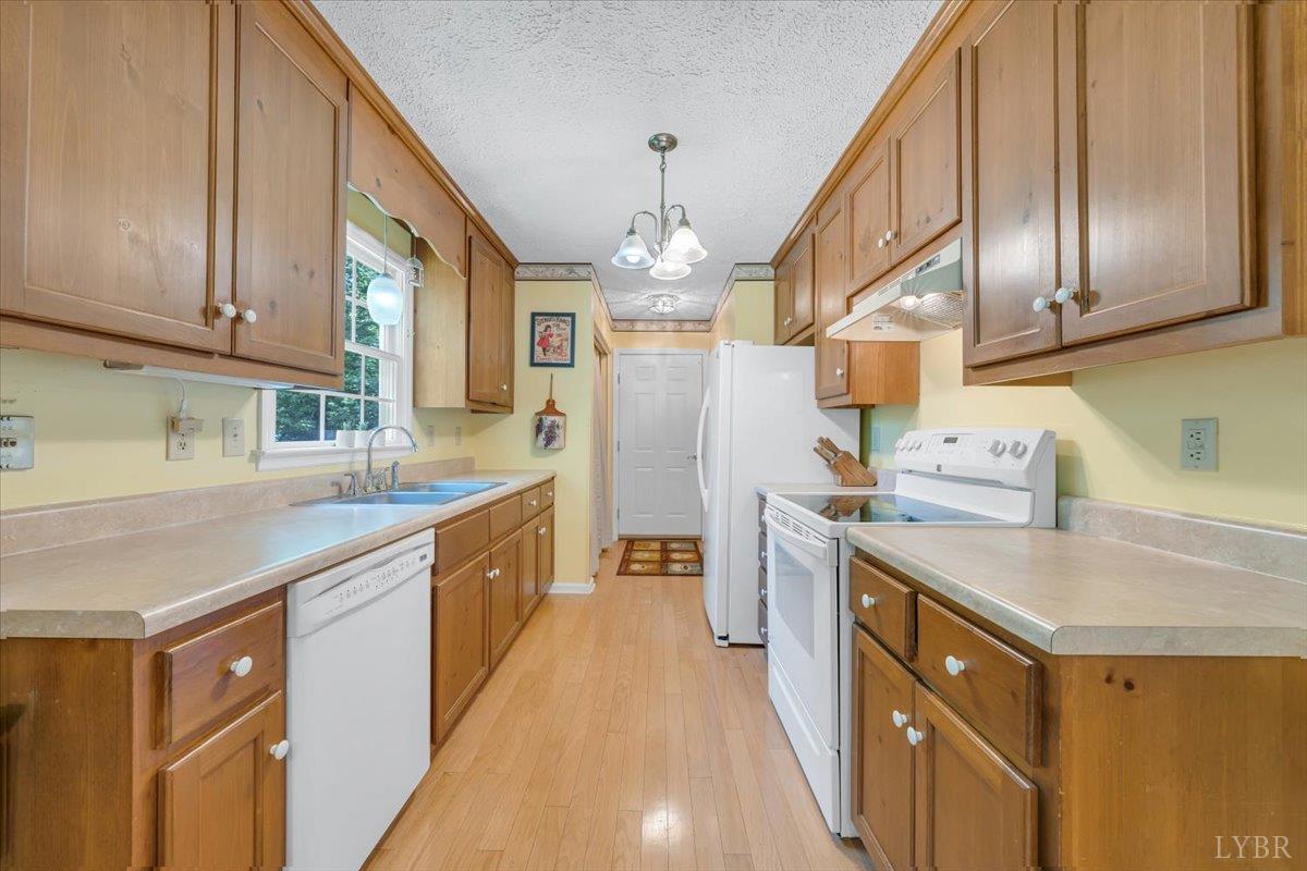 1124 Homeplace Road Bedford, VA 24523 - Photo 11 of 47 a kitchen with stainless steel appliances granite countertop a sink and cabinets