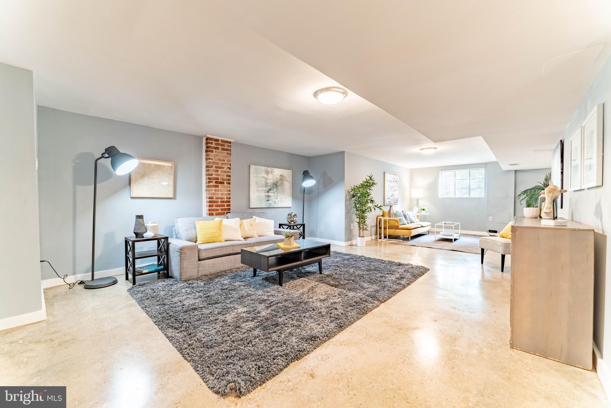 8400 Farrell Drive Chevy Chase, MD 20815 - Photo 20 of 36 Lower level with polished floors and exposed brick