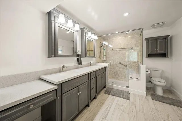 a kitchen with a refrigerator a stove and a cabinets