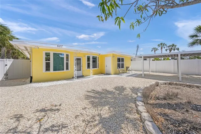 a view of a house with a snow in the yard