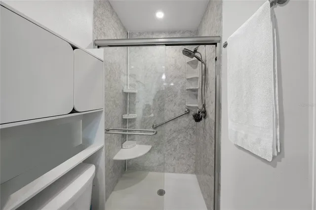 a view of a backyard with seating space