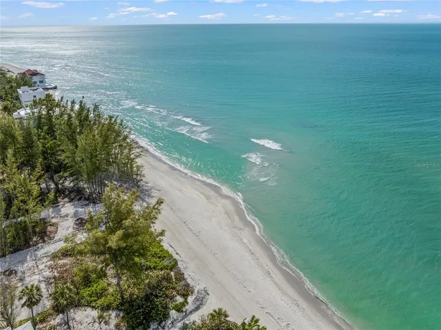 a front view of a house with outdoor seating
