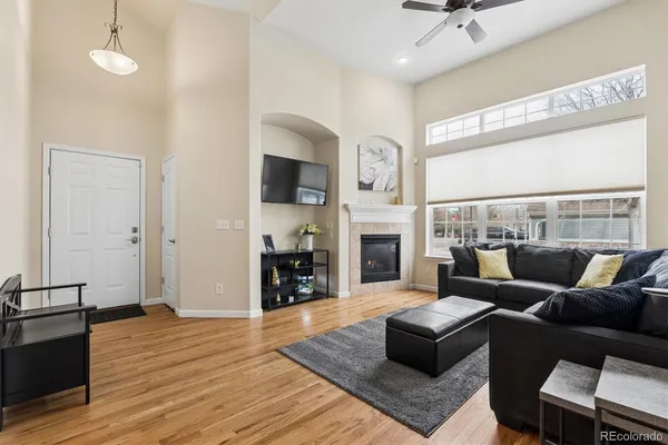 a living room with furniture and a fireplace