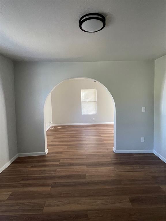 1041 Bradfield Road Dallas, TX 75217 - Photo 5 of 9 a view of a room with wooden floor