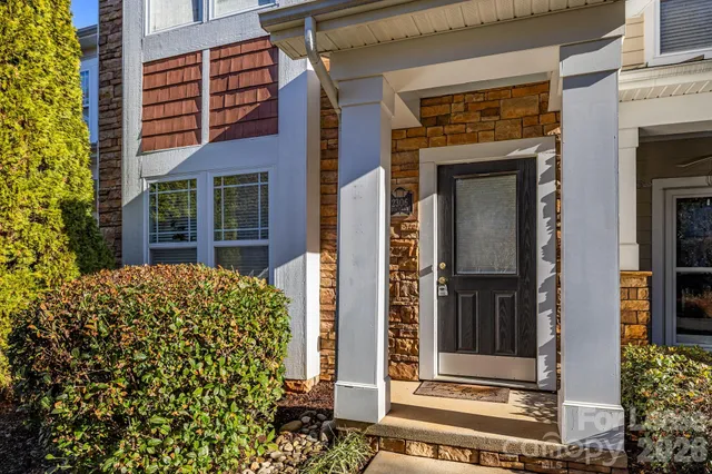 front door of house with a potted plant and door