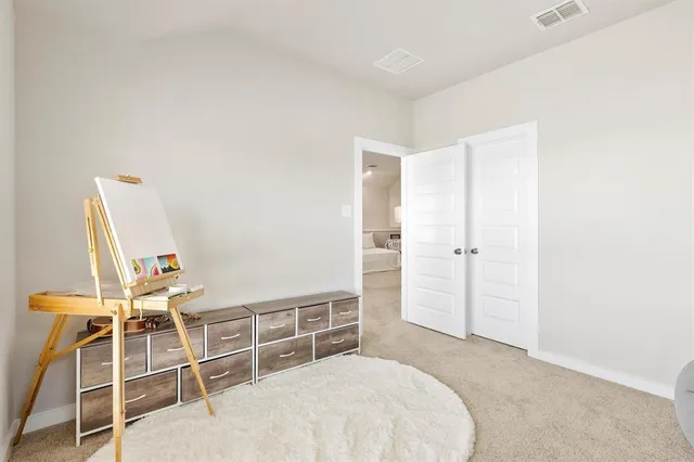 a bedroom with a bed and closet