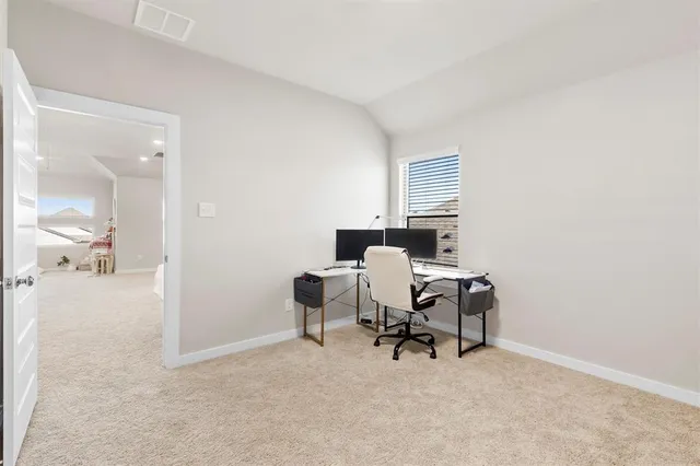 a view of a workspace with furniture