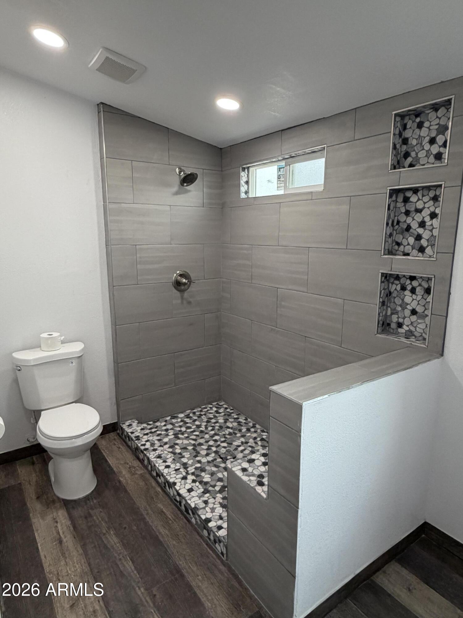 928 West Austin Street Bisbee, AZ 85603 - Photo 15 of 27 a bathroom with a sink a toilet and shower