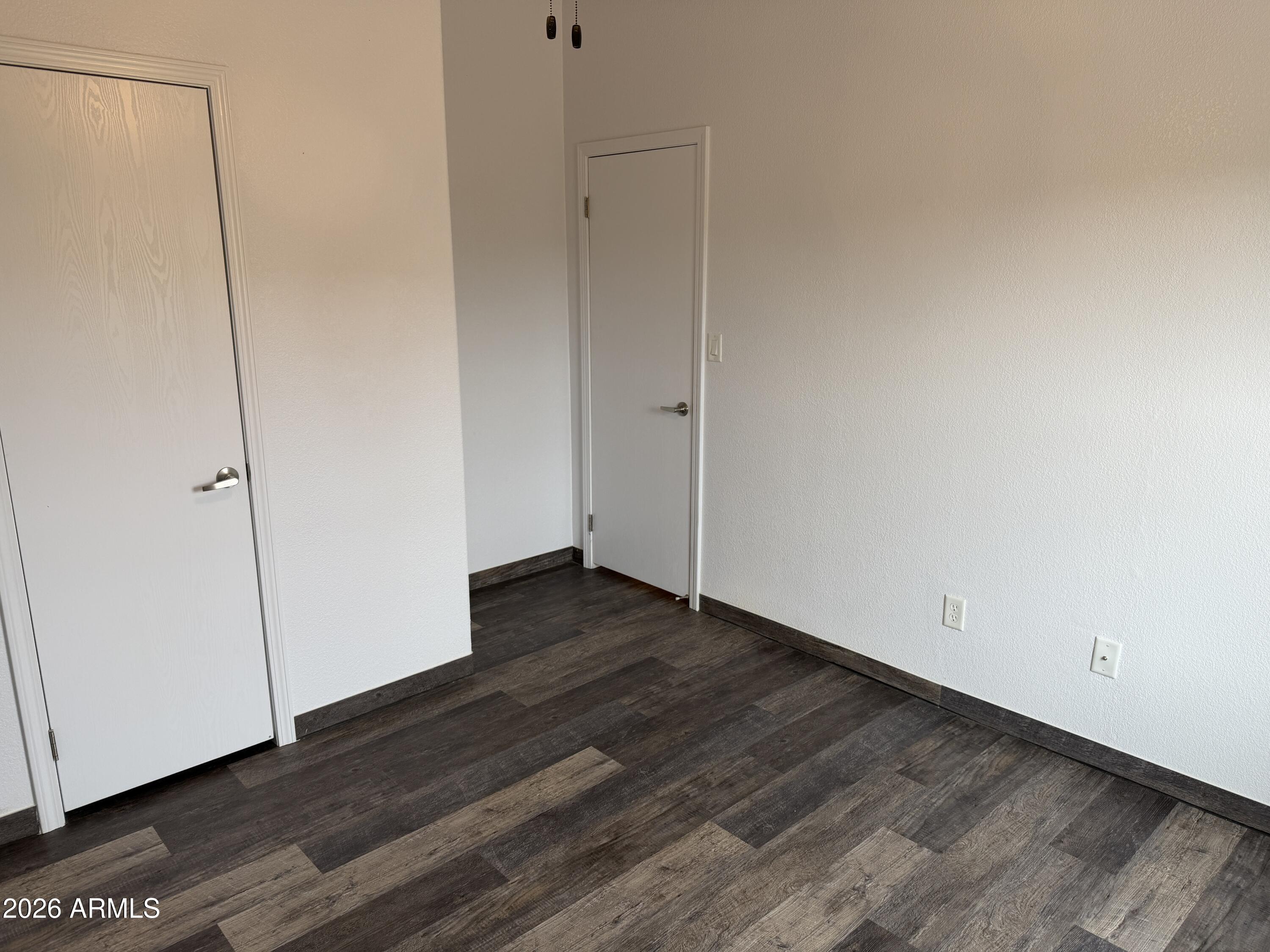928 West Austin Street Bisbee, AZ 85603 - Photo 18 of 27 a view of an empty room with wooden floor