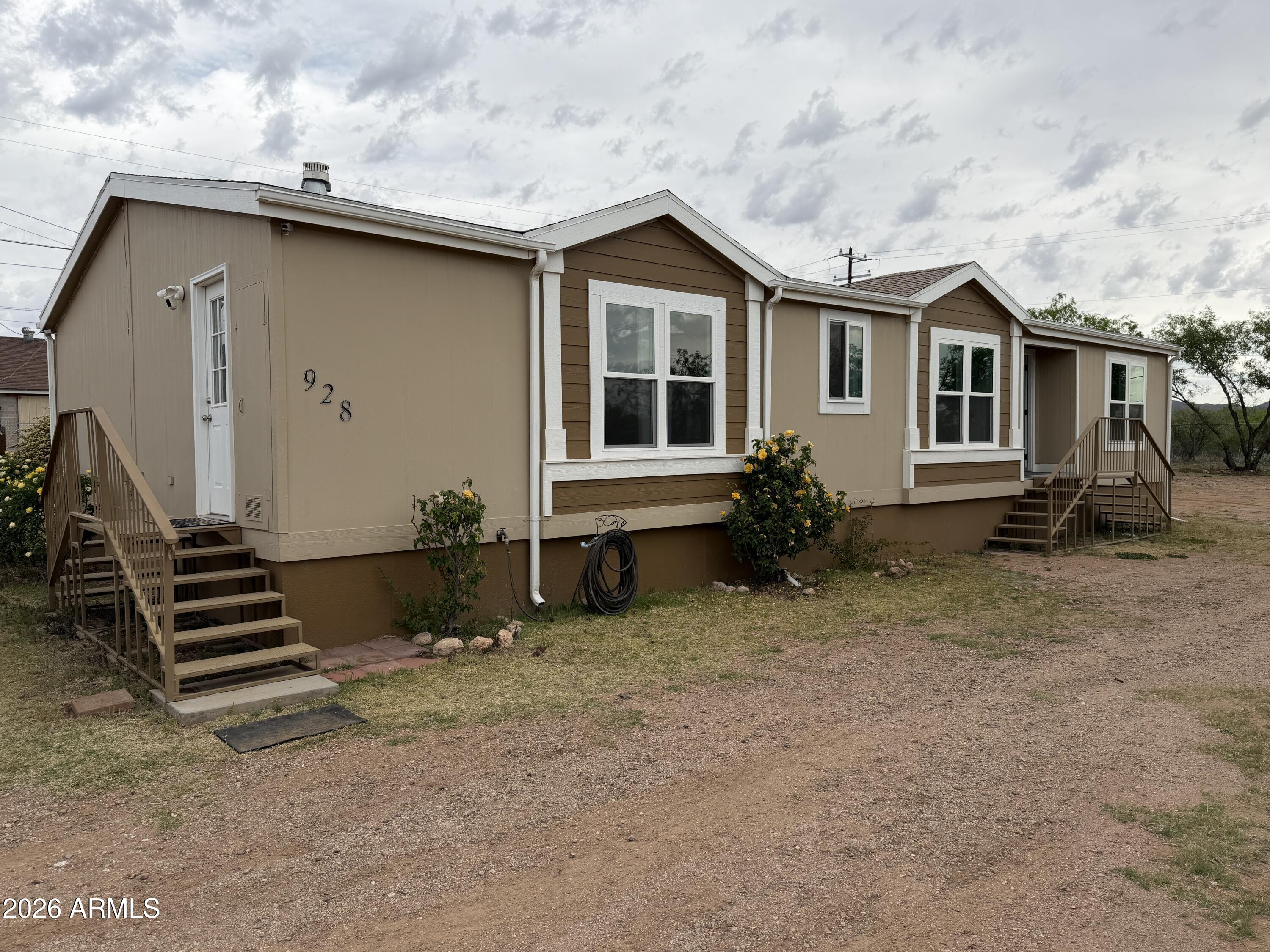 928 West Austin Street Bisbee, AZ 85603 - Photo 2 of 27 a house view with a backyard space