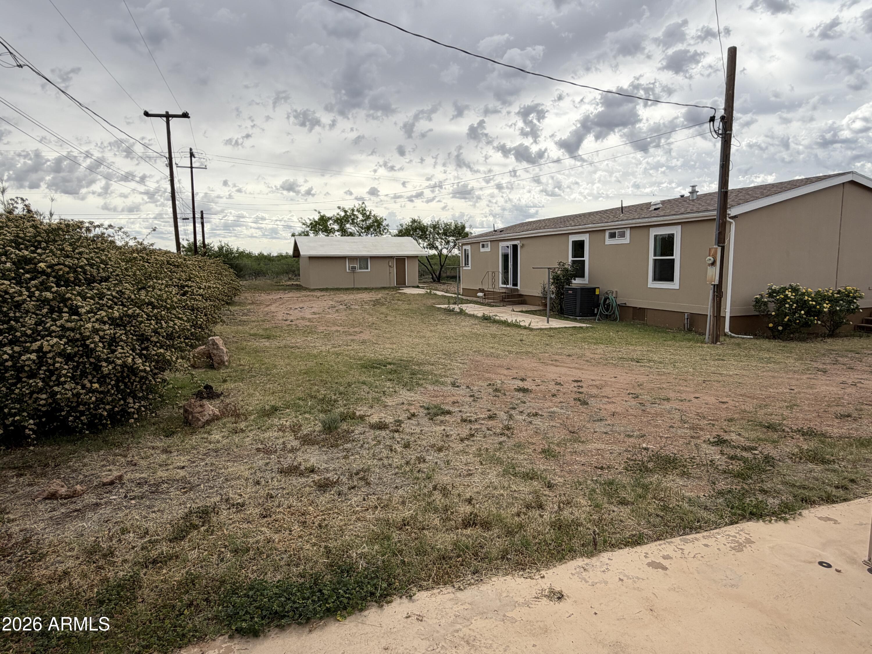 928 West Austin Street Bisbee, AZ 85603 - Photo 24 of 27 a view of a house with a backyard