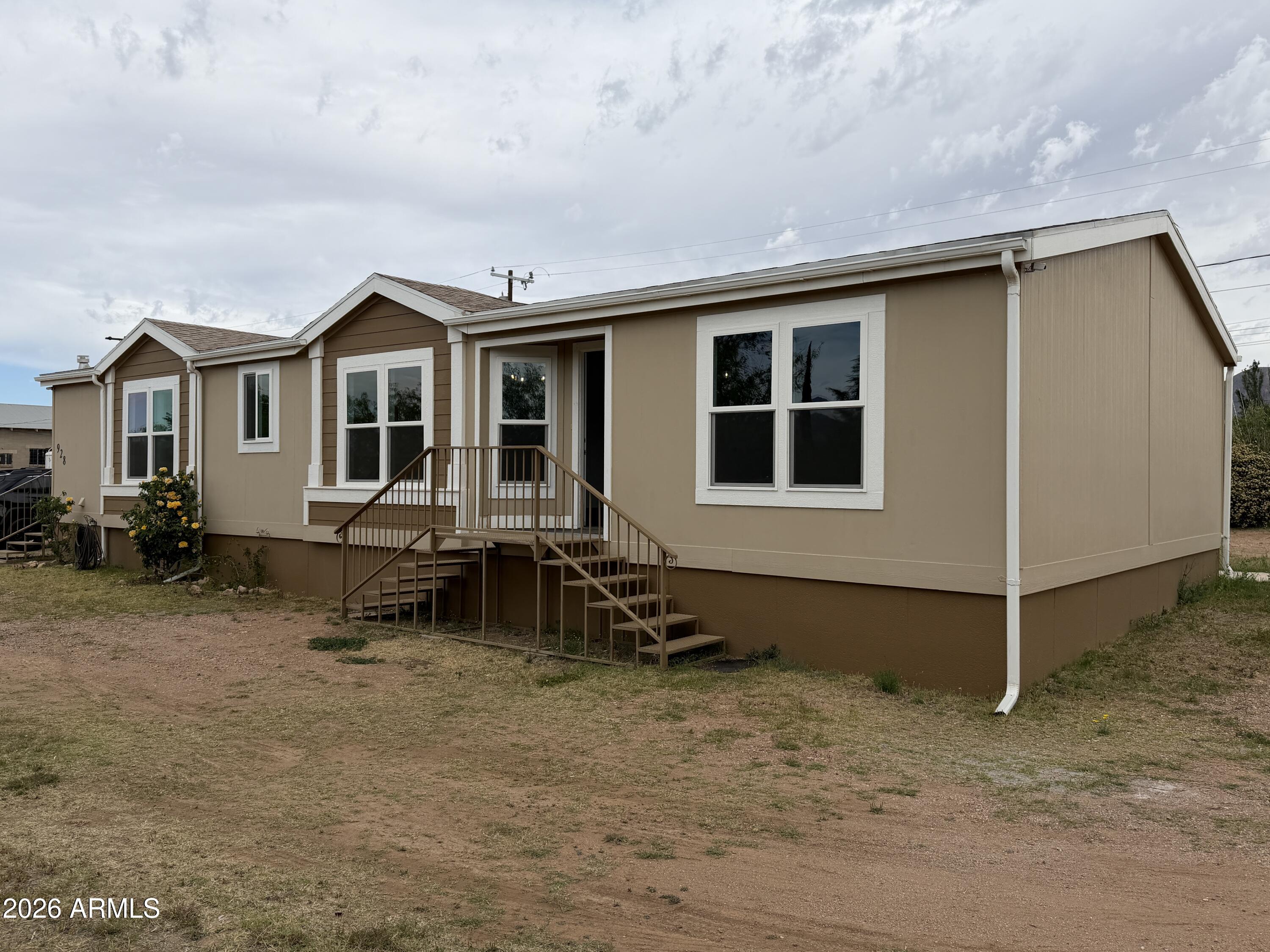 928 West Austin Street Bisbee, AZ 85603 - Photo 3 of 27 a backyard of a house with yard and seating space