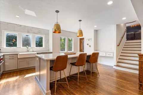 a view of a dining room with furniture and wooden floor