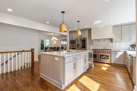 a living room with furniture a window and a fireplace