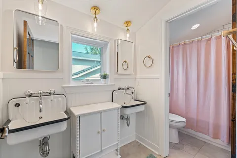 a view of walk in closet with clothes